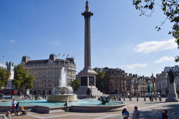 trafalgar square with a clear blue sky, london, uk - city of westminster big ben london england whitehall street imagens e fotografias de stock