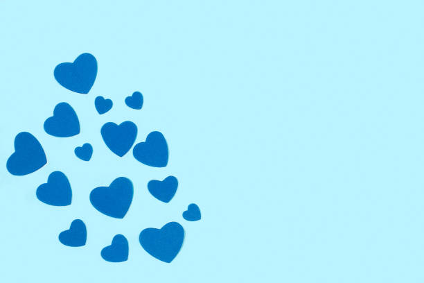 istock Blue paper hearts on a light blue background 1394032035