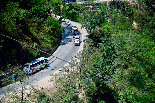 Kathmandu, Nepal April 17, 2022 Running vehicles around a mountain side highways in Nepal