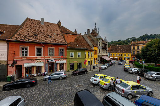 Sighișoara, Transilyania, Romania - August 24, 2021: The historic city of Sighisoara with the colorful houses in Transilyania Romania
