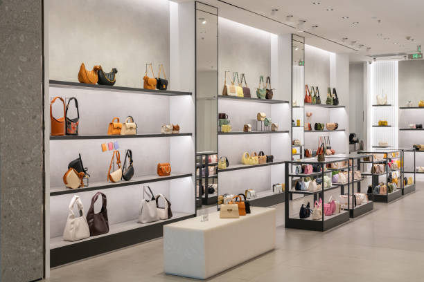 luxury fashion store front in modern shopping mall. - loja imagens e fotografias de stock