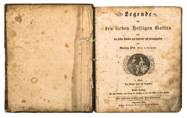 istock Open old book used paper pages isolated white background 1394033532