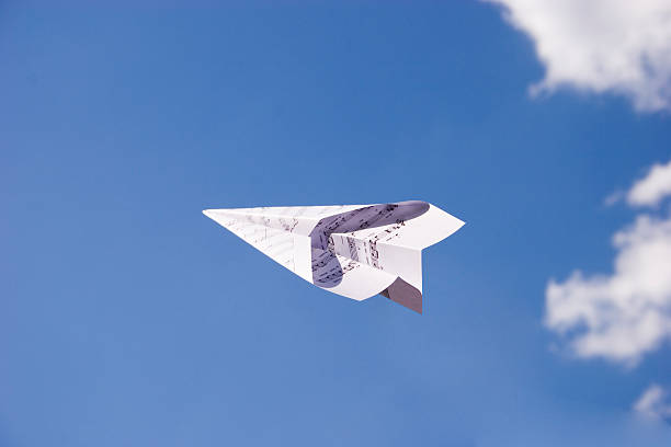 Musical Paper Plane in Flight stock photo