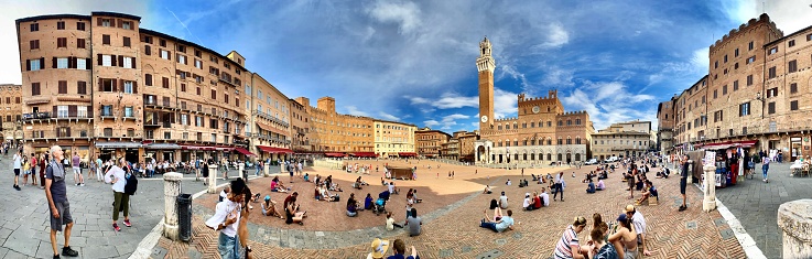 taking a walking tour of the unesco world heritage site, siena, tuscany, italy - september 2021.