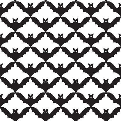 Seamless background with bats on the yellow background. Graphic seamless pattern.