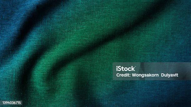 Close Up Texture Of Creased Fabric Gradient In Green And Blue Color Tone Woolen Fabric Wavy Cloth Background Showing Fiber Detail Gradient Drapery Background With Beautiful Light And Shadow Stock Photo - Download Image Now