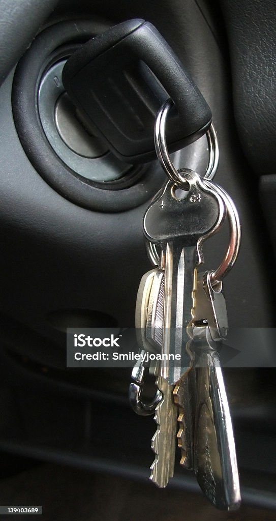 Keys - car keys in ignition Car keys in ignition about to start the car Driving Stock Photo