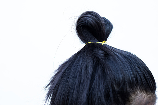 Natural black hair of thai girl against white background