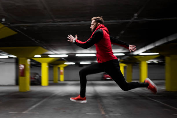 istock Young athlete man is running fast in garage 1394039105