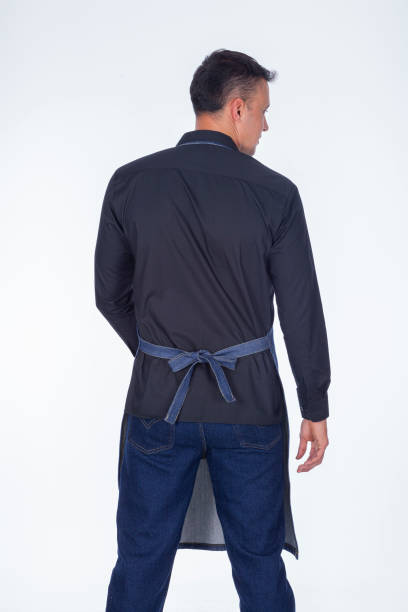 istock Latin man dressed in apron uniforms turns his back to the camera 1394040603
