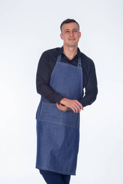 istock Latin man dressed in apron uniforms looks towards the camera 1394041214