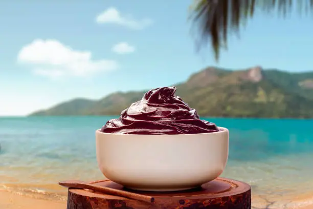 Acai bowl on background tropical beach