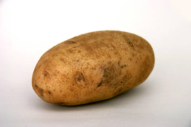 картофель - raw potato full length human eye root стоковые фото и изображения