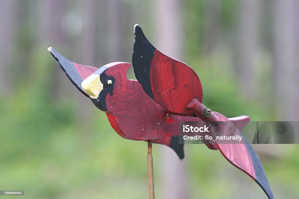 Weathered Cardinal Whirligig Weathered red cardinal whirligig. Bird Stock Photo