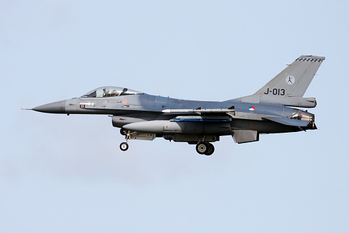 Leeuwarden / Netherlands - April 13, 2015: Royal Netherlands Air Force Lockheed Martin F-16AM Fighting Falcon J-013 fighter jet arrival and landing at Leeuwarden Air Base for Frisian Flag 2015 Air Exercise