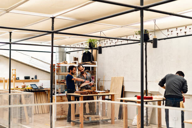 istock Group of carpenters doing their work 1394047169