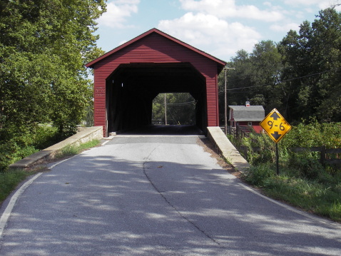 West Cornwall Covered Bridge. also known as Hart Bridge, is a wooden lattice truss bridge over the Housatonic River view from Sharon.