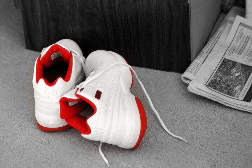 All desaturated (black and white) except for the red colour on the basketball shoes.