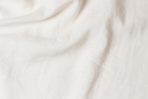 Fondo de textura de tela de lino arrugado blanco. Fondo de lienzo de lino ecológico ecológico orgánico de lino natural. Vista superior photo