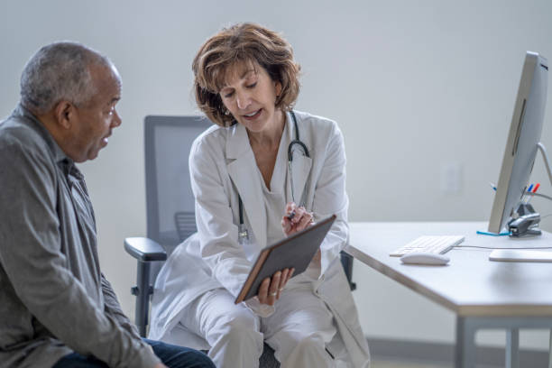 istock Senior Gentleman at a Doctors Appointment 1394053218