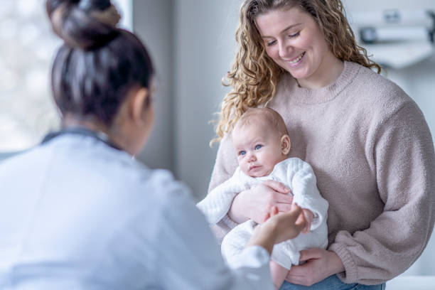 istock Baby Holding a Doctors Finger 1394055279
