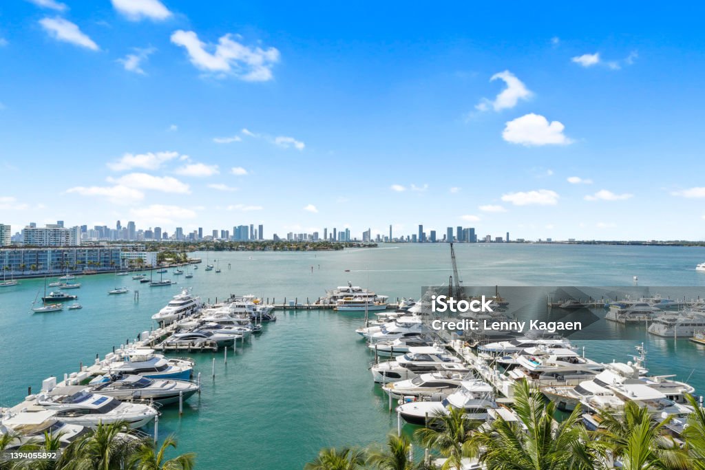 Miami Marina during the day Aerial imagery capture’s a “birds eye view” of a marina in Miami with a skyscraper background Miami Stock Photo