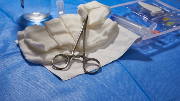 istock Metal forceps and sterile gauze swabs 1394056985