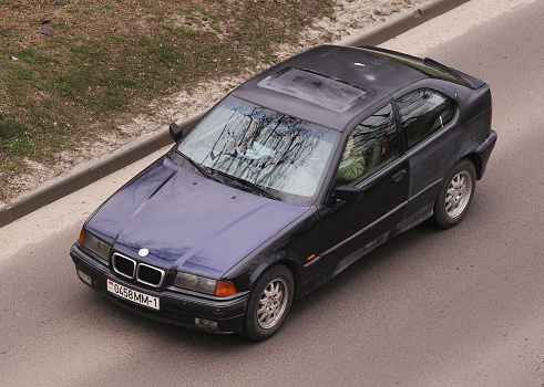 Belarus, Minsk-18.04.2022:BMW 3-series Compact E36 is driving on the road in the city.
