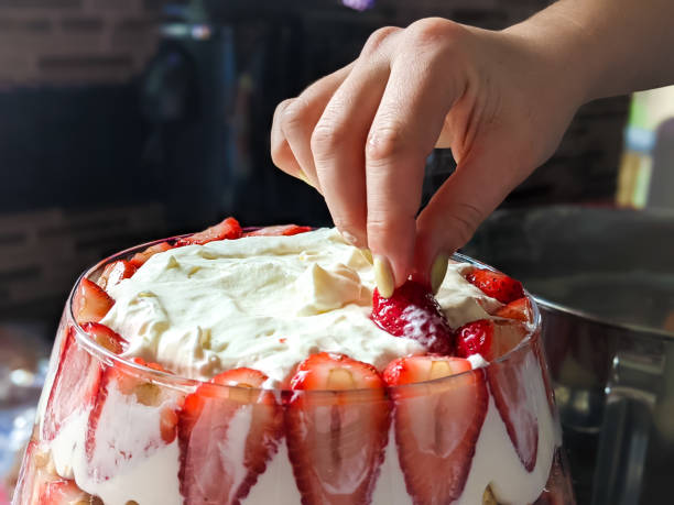 Strawberry Trifle Preparing homemade dessert strawberry trifle trifle stock pictures, royalty-free photos & images