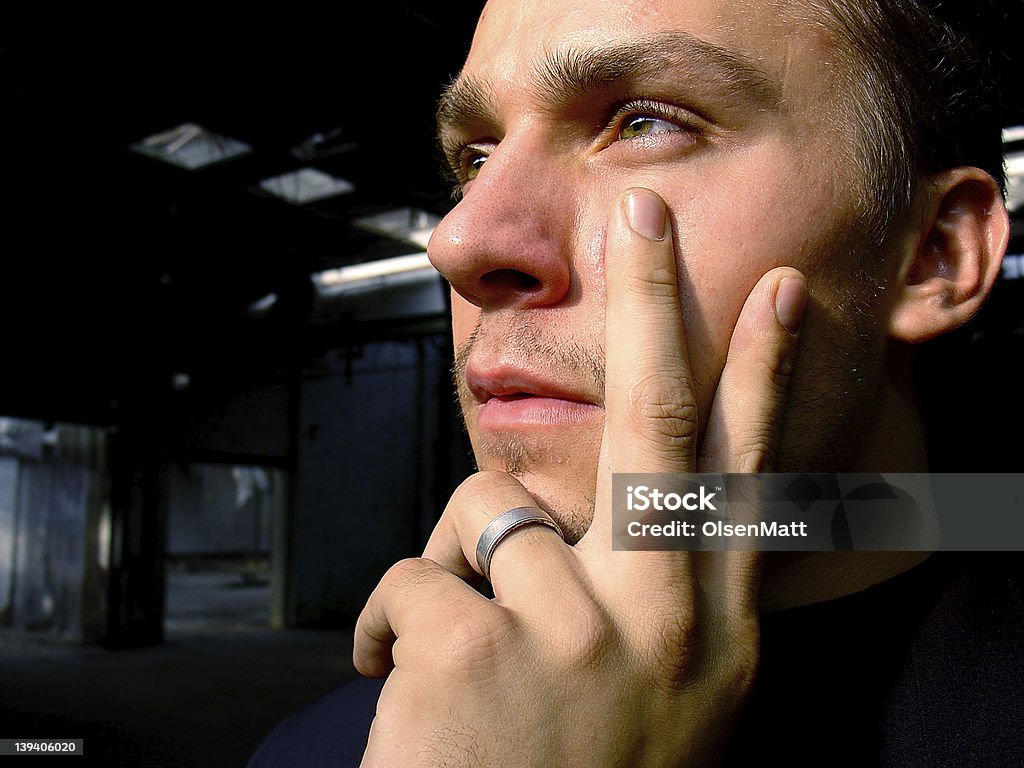 Strong Wisdom Young successful businessman with deep thoughts, thinking about a solution, the future, or the past. This image depicts wisdom, power, success, confidence, etc. Abandoned Stock Photo