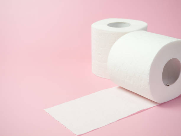 istock Toilet paper roll on pink background, Space for text 1394060622