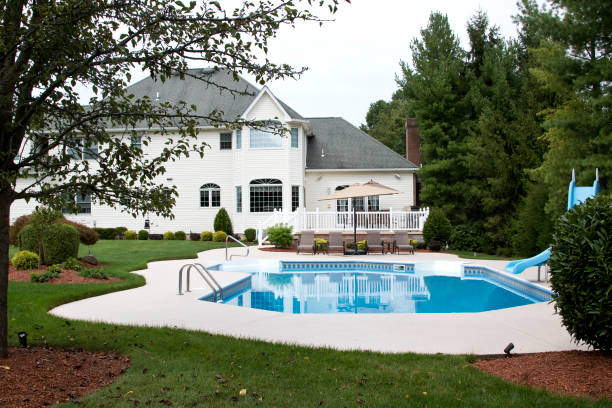 istock Large suburban house pool side 1394060825