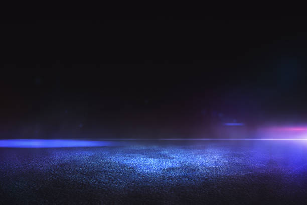 Abstract empty background with dark asphalt and neon purple, blue and pink light spots for car presentation stock photo