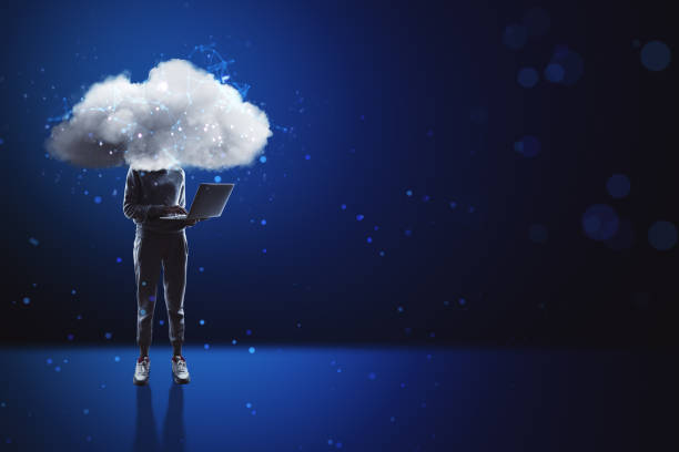 istock Cloud headed hacker with laptop standing on abstract blue bokeh interior background with mock up place. Sky is the limit, motivation concept. 1394062080