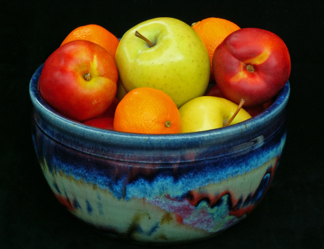 pottery bowl filled with fresh fruit