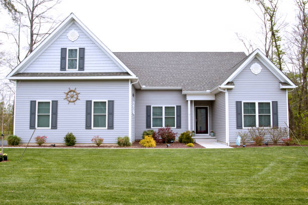 Suburban house front view Exterior of home with manicured lawn in the suburbs. looking out front door stock pictures, royalty-free photos & images