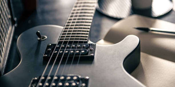 istock Close-up, electric guitar and notepad, concept of musical creativity. 1394063787