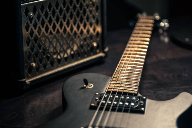 istock Close-up, black electric guitar on a dark background. 1394063788