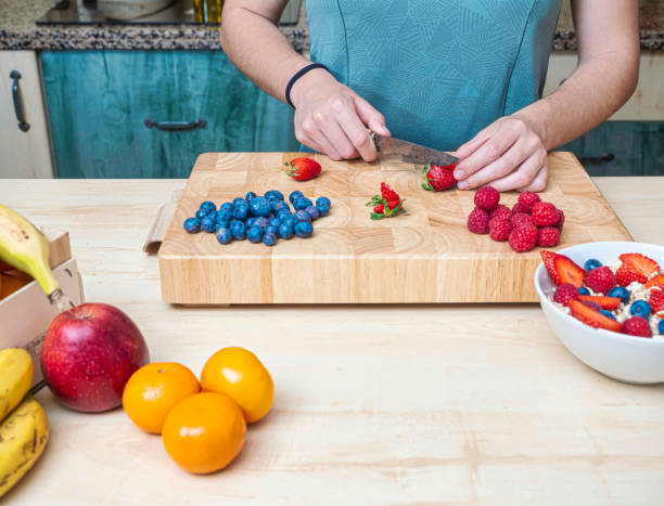 istock Woman in her kitchen preparing a healthy snack. 1394063967
