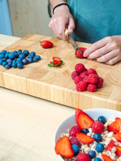 istock Woman in her kitchen preparing a healthy snack. 1394063973