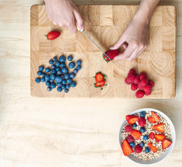 istock Woman in her kitchen preparing a healthy snack. 1394064067