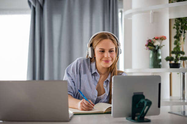 istock Woman multi-tasking in home office 1394069378