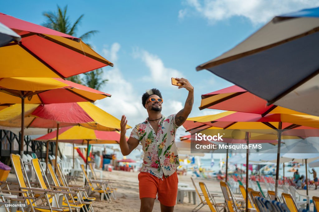 Man vlogging on the beach Tourist, Beach, Porto de Galinhas, Latin America, Brazil Influencer Stock Photo