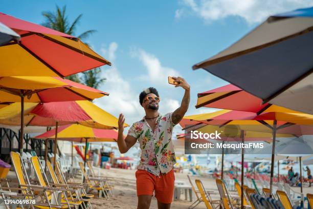 Man Vlogging On The Beach Stock Photo - Download Image Now - Influencer, Beach, Selfie