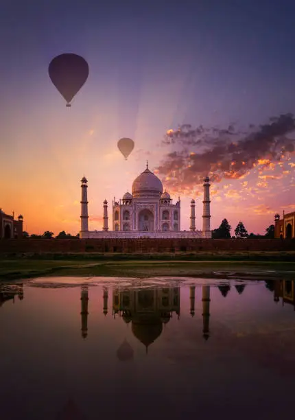 Hot air balloons soaring over the Taj Mahal in Agra city.