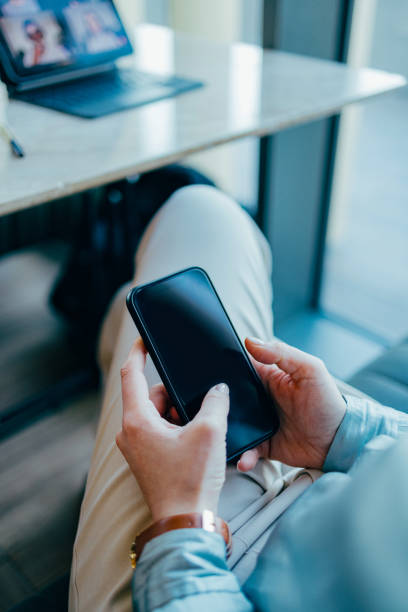 istock Anonymous Woman Holding a Smartphone and Typing (Copy Space) 1394074504