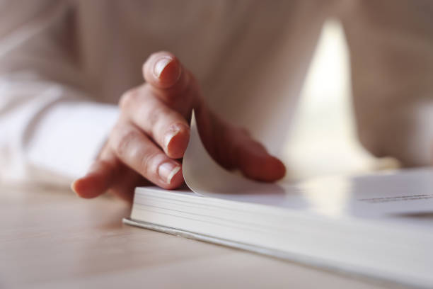 Close-up hand women open a book