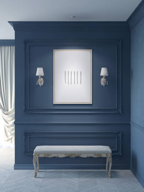 dark blue classic hall with sconces flanked by an illuminated vertical poster on a wall with moldings, a light exquisite bench on a white parquet floor, a curtained window in the background. - accent wall imagens e fotografias de stock
