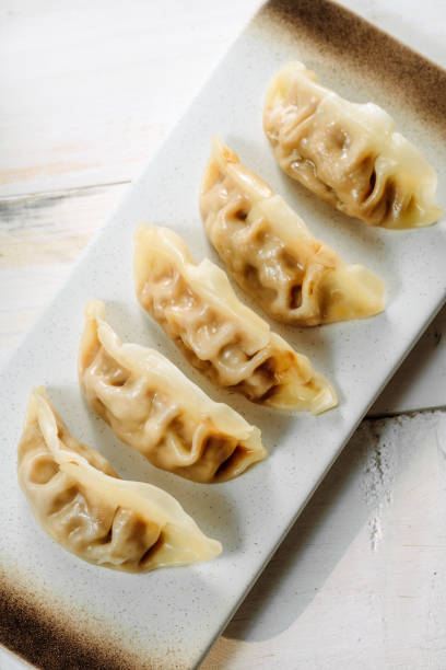 istock Dumplings, steamed stuffed buns, soybean milk 1394092305