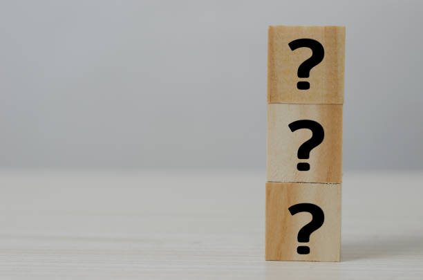 istock Square wooden block icon question mark symbol copy space. 1394092408